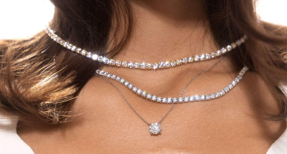 Female model wearing Lab-grown diamond tennis necklace design by Jean Dousset featured in desktop banner