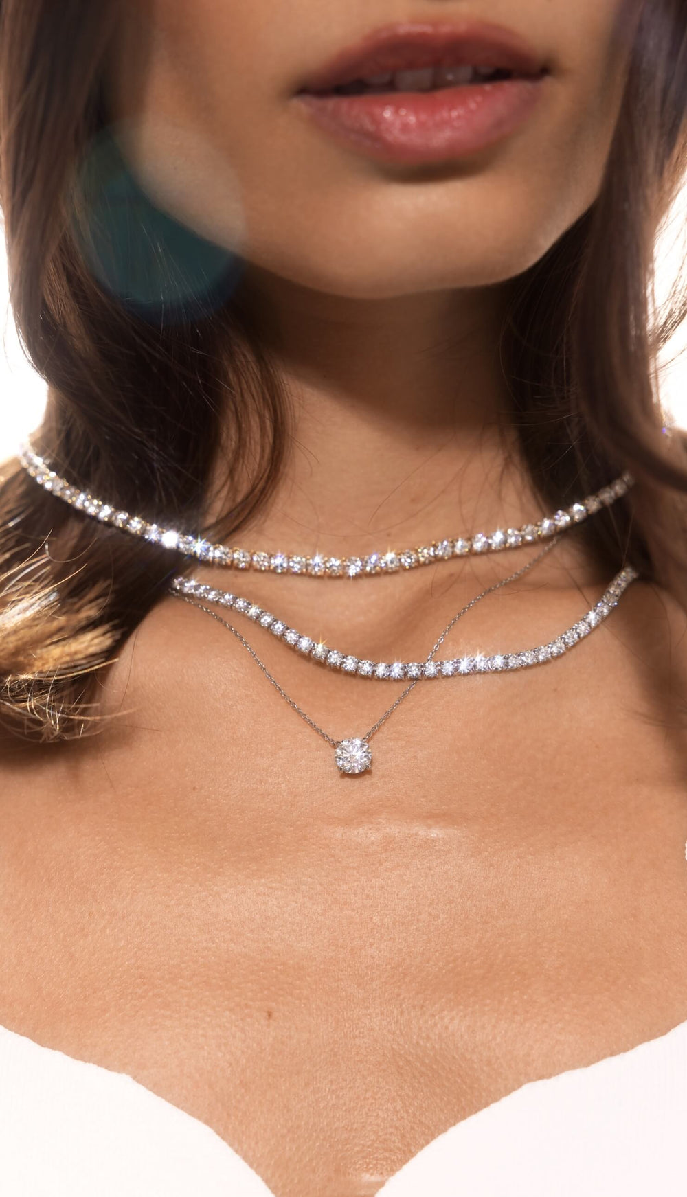 Female model wearing Lab-grown diamond tennis necklace design by Jean Dousset featured in desktop banner